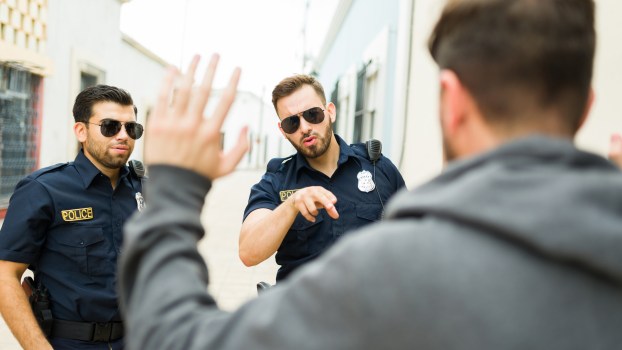 Police officers arresting a man
