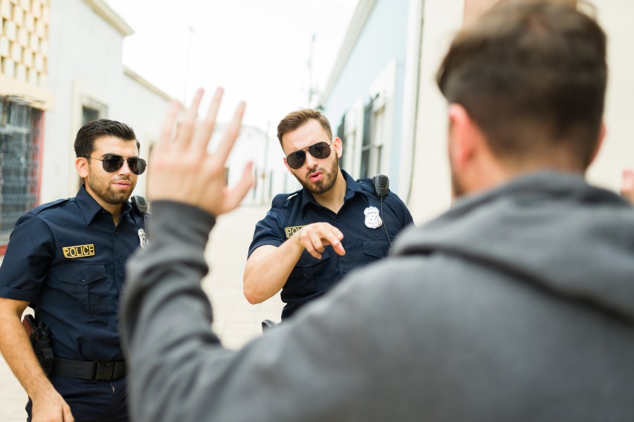Police officers arresting a man