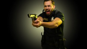 Police officer holding a gun and yelling after car thief backed over his foot.