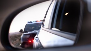 Police-traffic-stop-for-speeding-in-rear-view-mirror