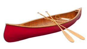 Bright red canoe with two wooden paddles leaned against it.