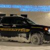 Schoharie County New York Sheriff's Office patrol SUV covered in ice parked in right front angle view