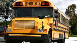 Yellow school bus in parking lot.