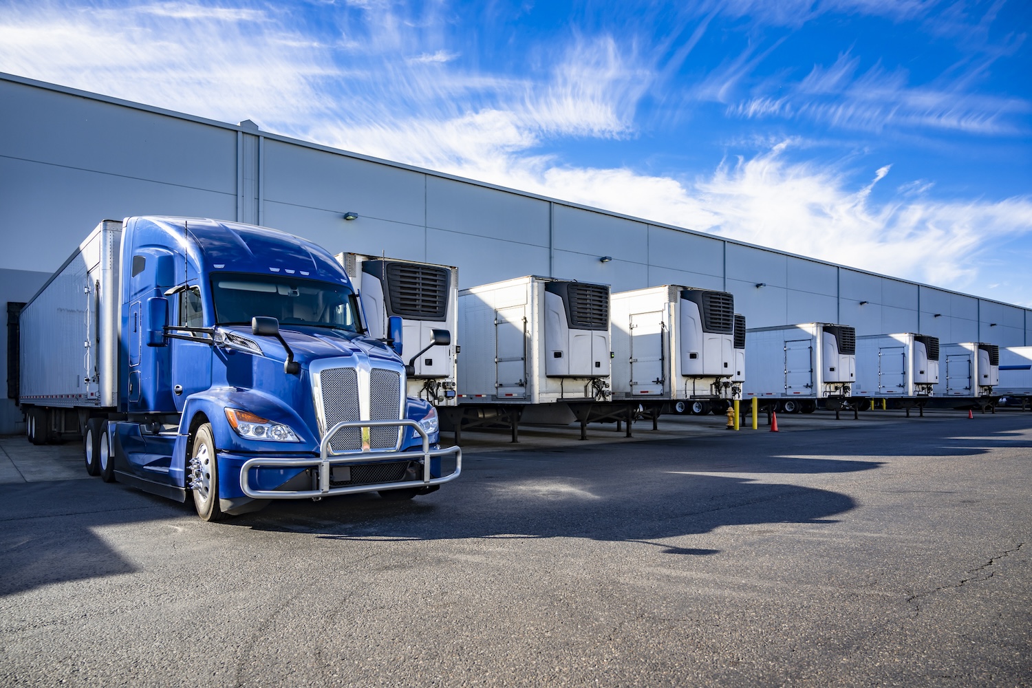 A semi-truck at a warehouse