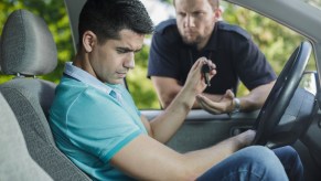 A police officer talking to a driving during a traffic stop