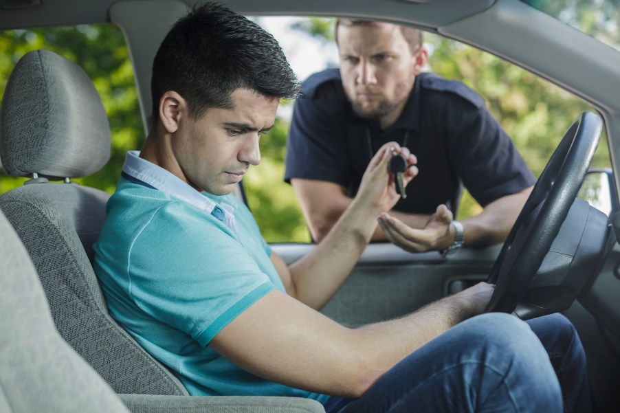 A police officer talking to a driving during a traffic stop