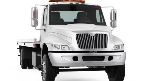 Render of an unmarked white flatbed tow truck on a white background.