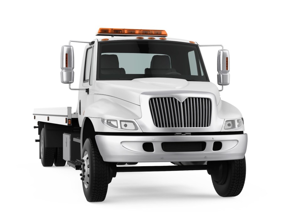 Render of an unmarked white flatbed tow truck on a white background.