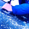 man-scraping-ice-off-car-windshield