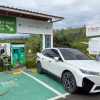 White BMW EV wagon charges at a station in Colombia, South America