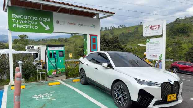 White BMW EV wagon charges at a station in Colombia, South America