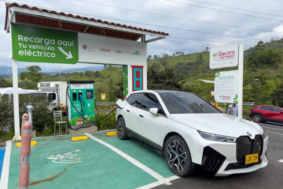 White BMW EV wagon charges at a station in Colombia, South America