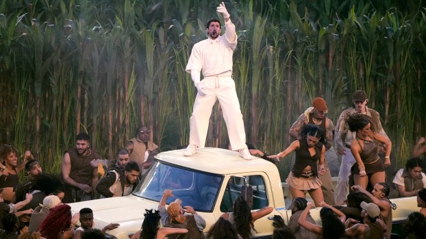 Bad Bunny standing on a truck