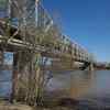 Bridge stretching across the Ohio River, trees visible in the background.