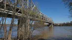 Bridge stretching across the Ohio River, trees visible in the background.