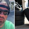 Man shows new car tires (l) car tires (r)