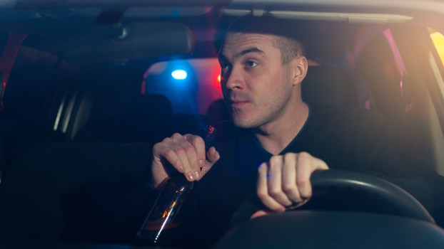 A drunk driver being stopped by police