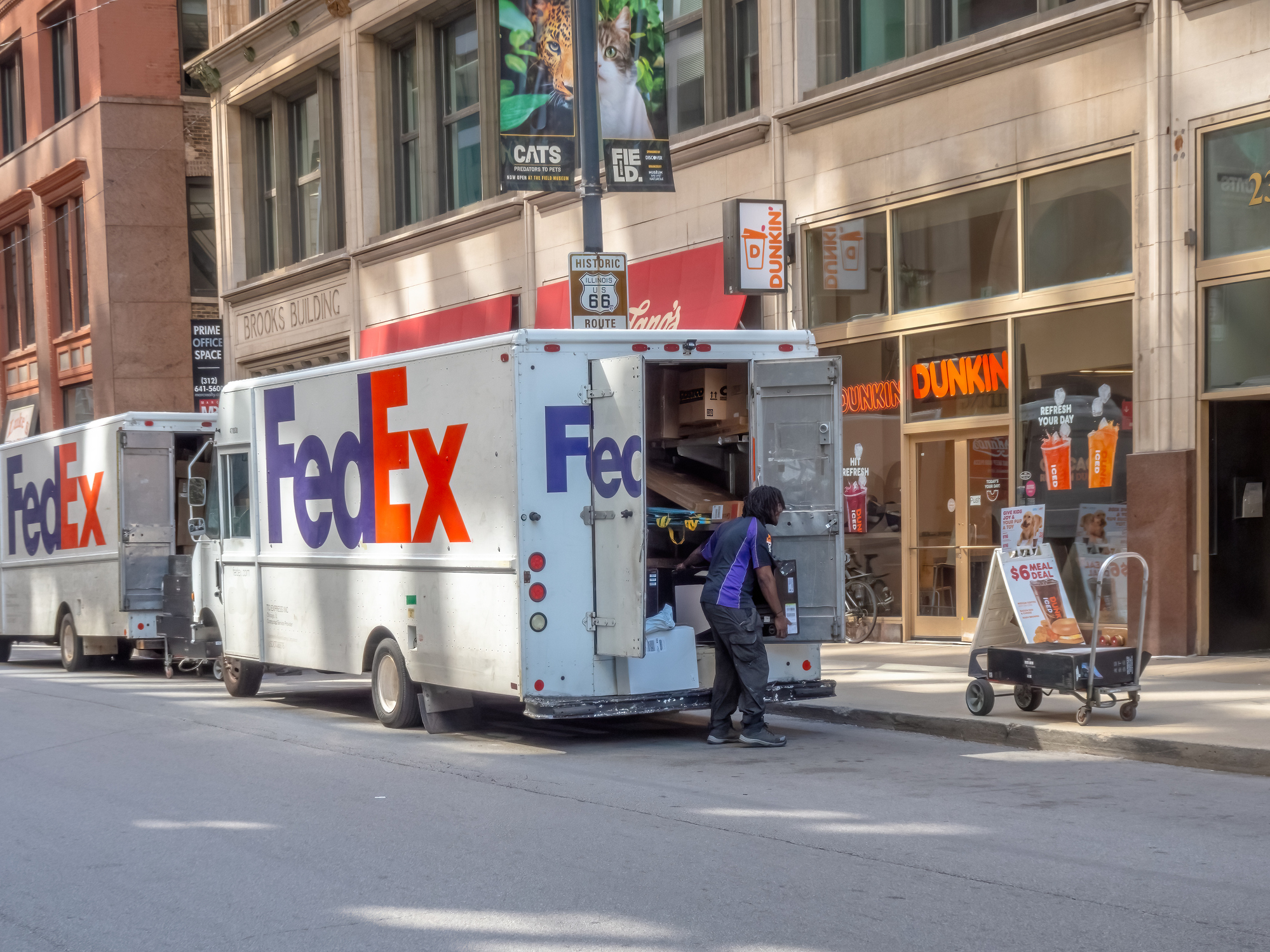 FedEx trucks making deliveries