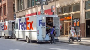 FedEx trucks making deliveries