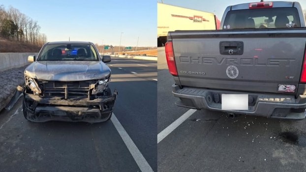 Gray Chevrolet Colorado with bumper caved in and grill gone.