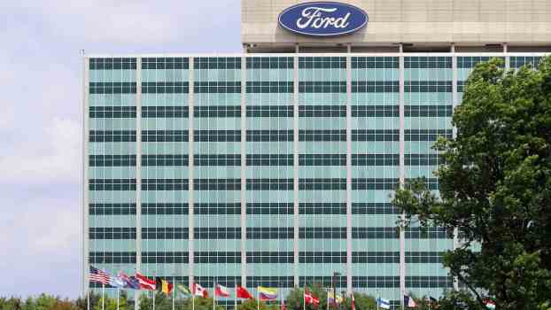 The Ford logo atop the company's world headquarters building in Michigan.