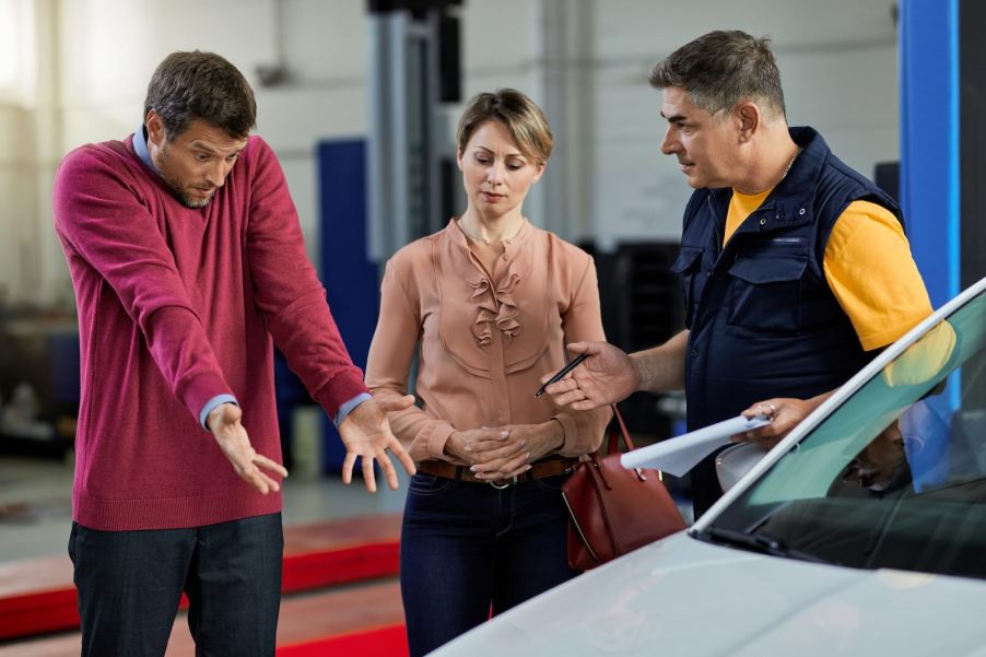 Couple argues with dealership employee in Ford service center.