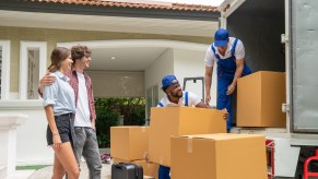 Movers loading furniture into truck
