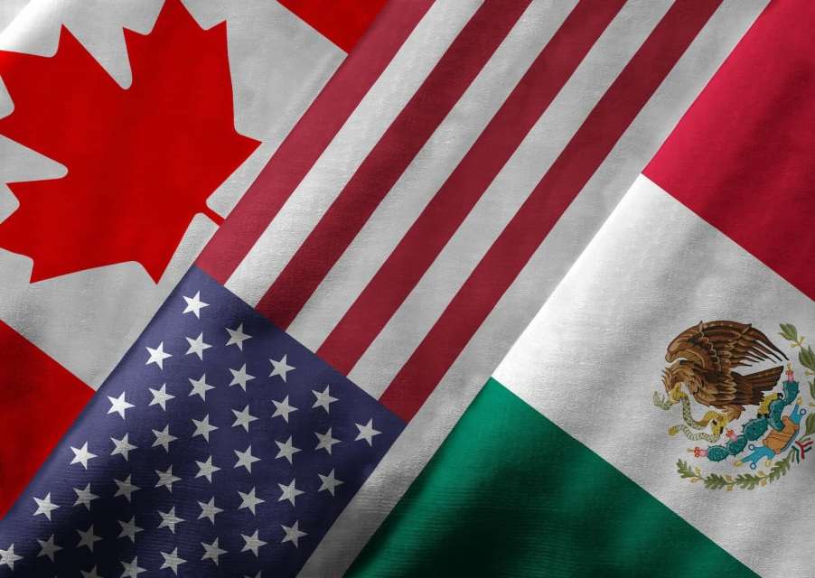 The Canadian, U.S., and Mexican national flags, stacked on top of one another