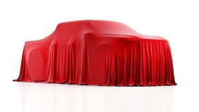 Chevrolet Silverado EV Trail Boss under a red cover.