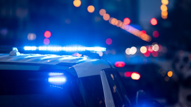 Police SUVs with their lights on