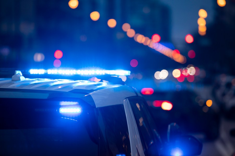 Police SUVs with their lights on