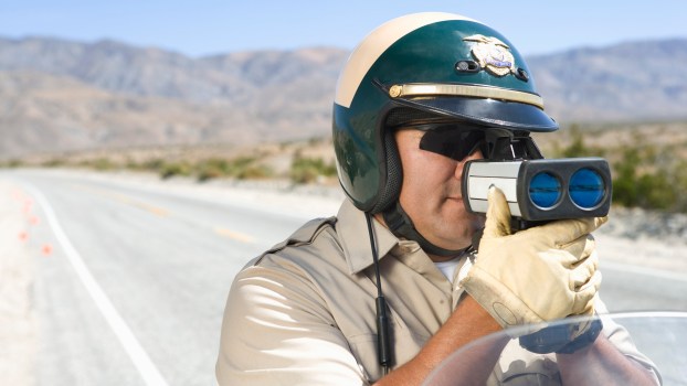 A Police Officer With Radar Gun