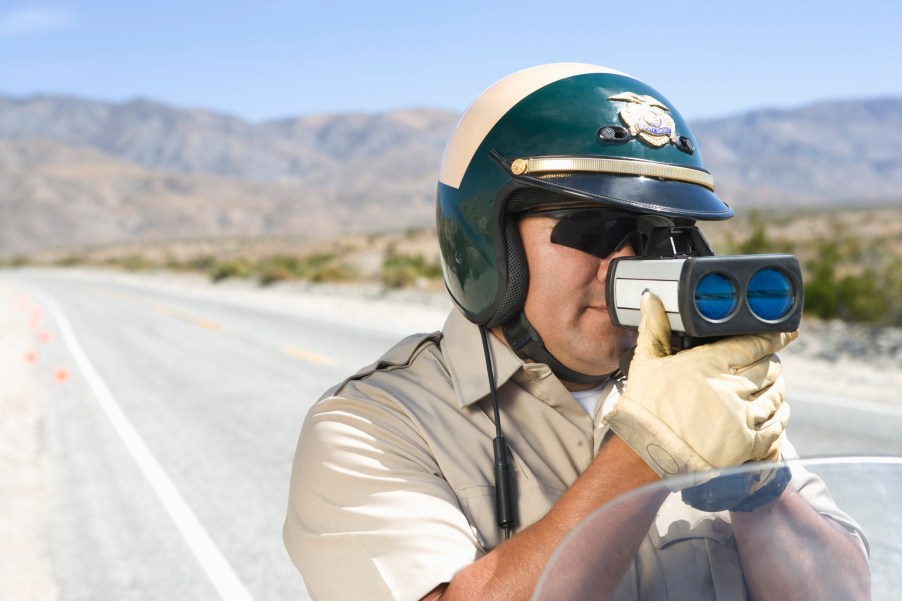 A Police Officer With Radar Gun