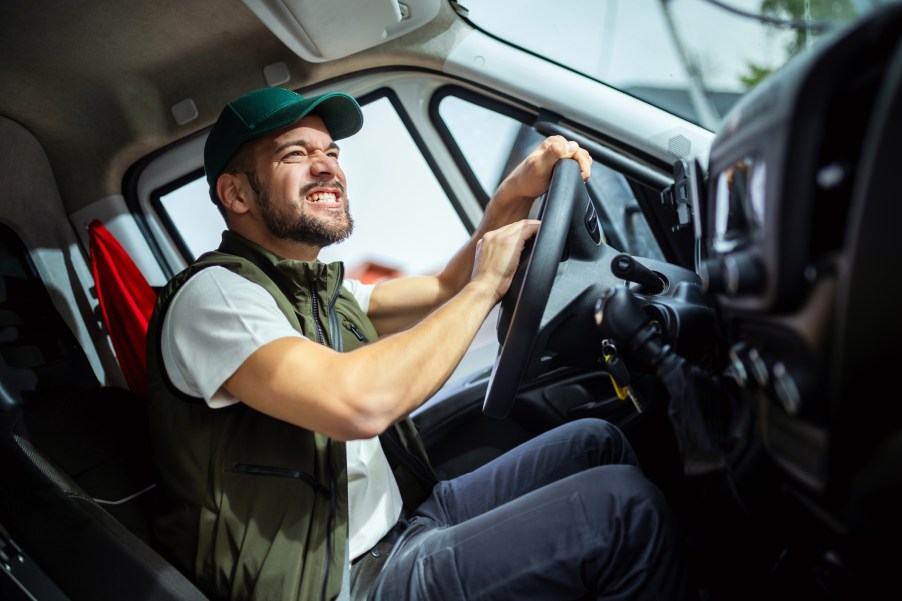 An angry truck driver in a semi-truck cab