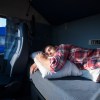 A man sleeping in an RV