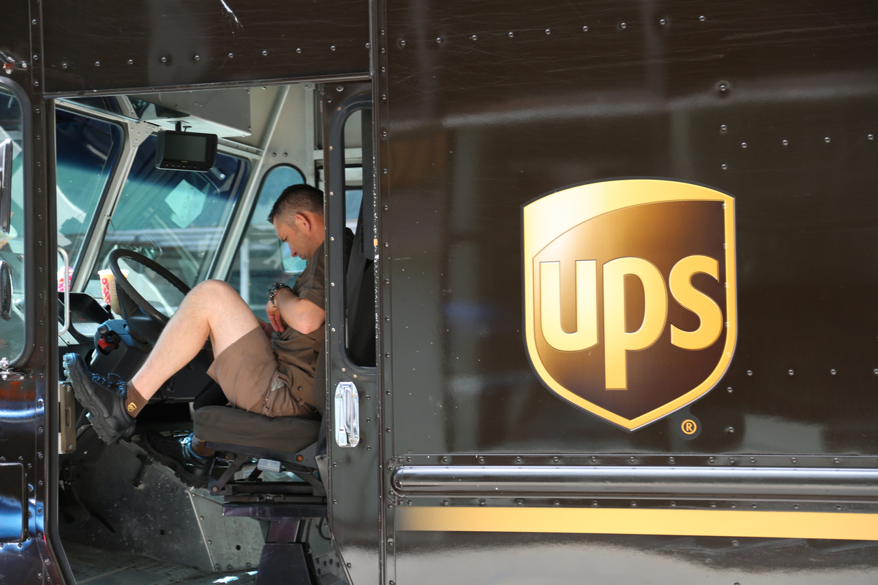 A UPS driver in a delivery truck