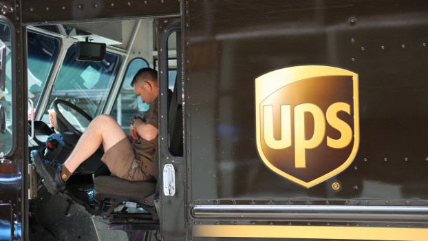 A UPS driver in a delivery truck