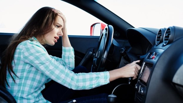 Driver tries to start an unreliable new car.