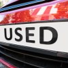 A a car with a used sign on it