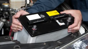 auto-mechanic-replacing-car-battery