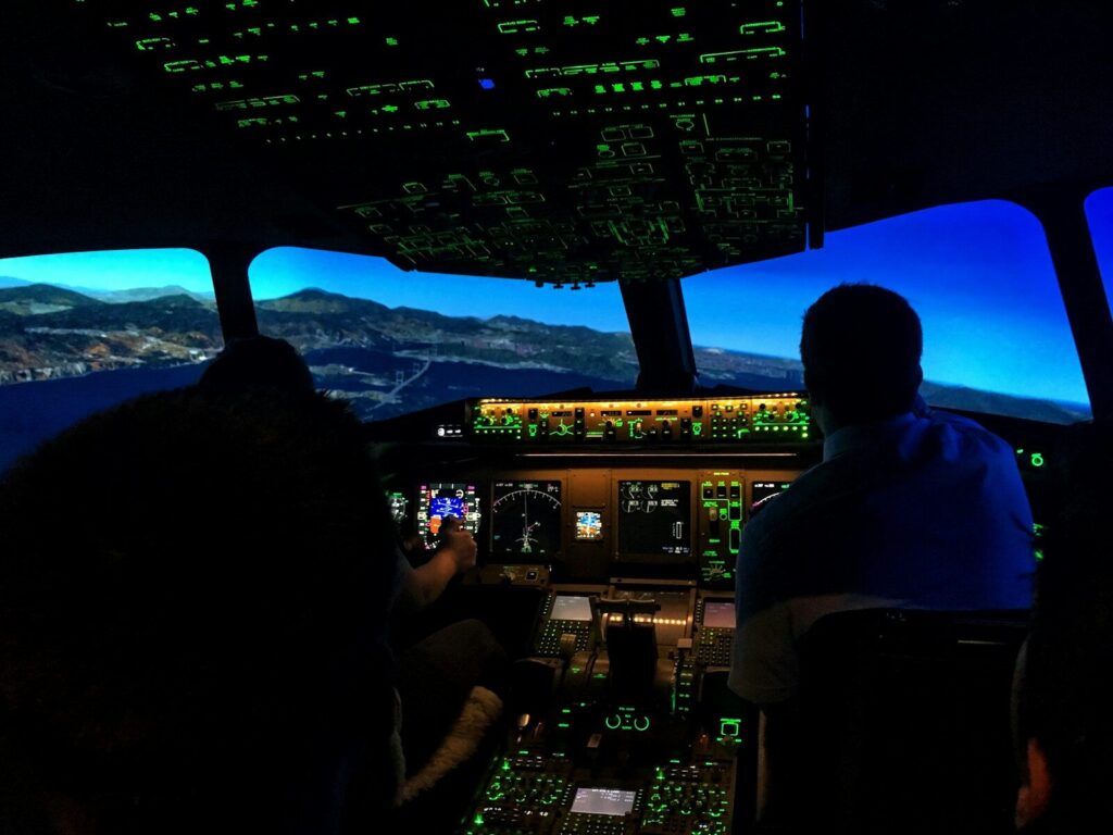 two men sitting on aircraft control panel. Phoenix