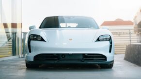 a white sports car parked in a garage. Porsche