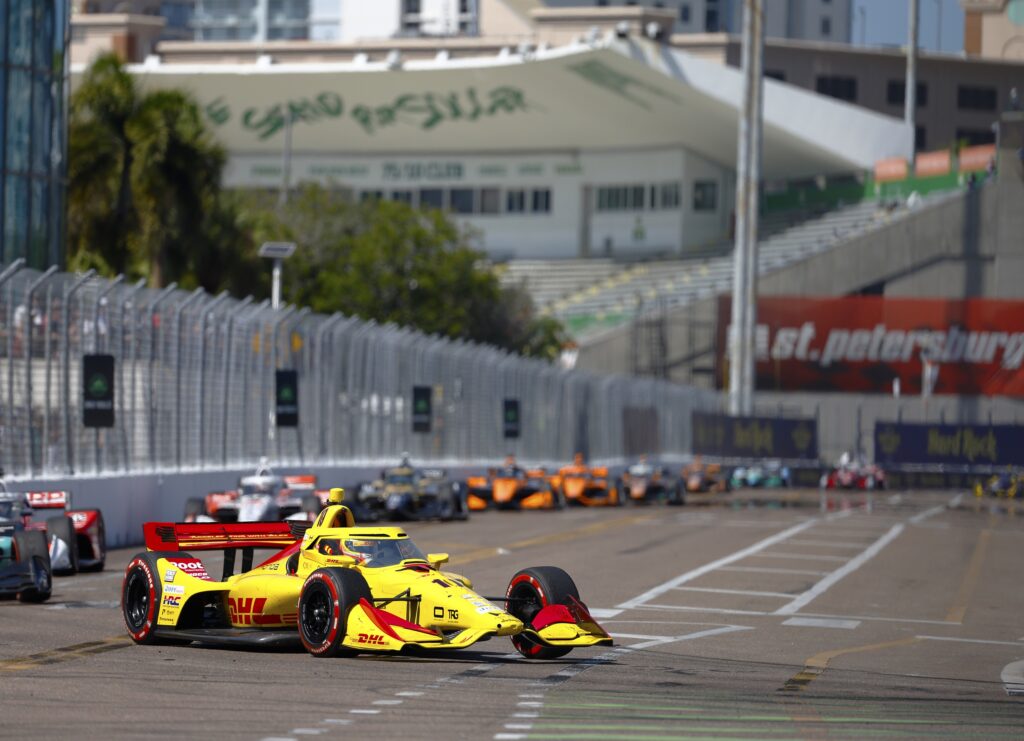Mar 1, 2026; St. Petersburg, Florida, USA; Chip Ganassi Racing driver Alex Palou (10) leads the pack out of the speedzone during the NTT Indycar Series at the Firestone Grand Prix on the Streets of St. Petersburg. Mandatory Credit: Russell Lansford-Imagn Images