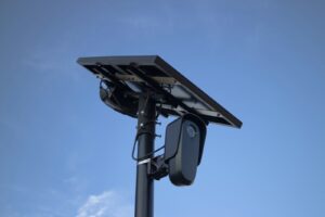 A solar panel powers a security camera. ALPR camera
