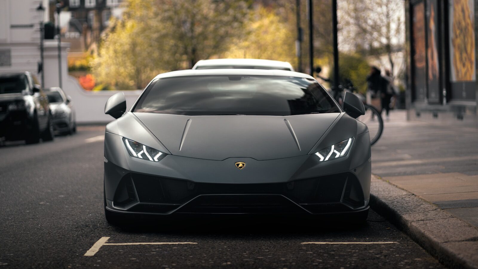a car parked on the side of a street. Lamborghini