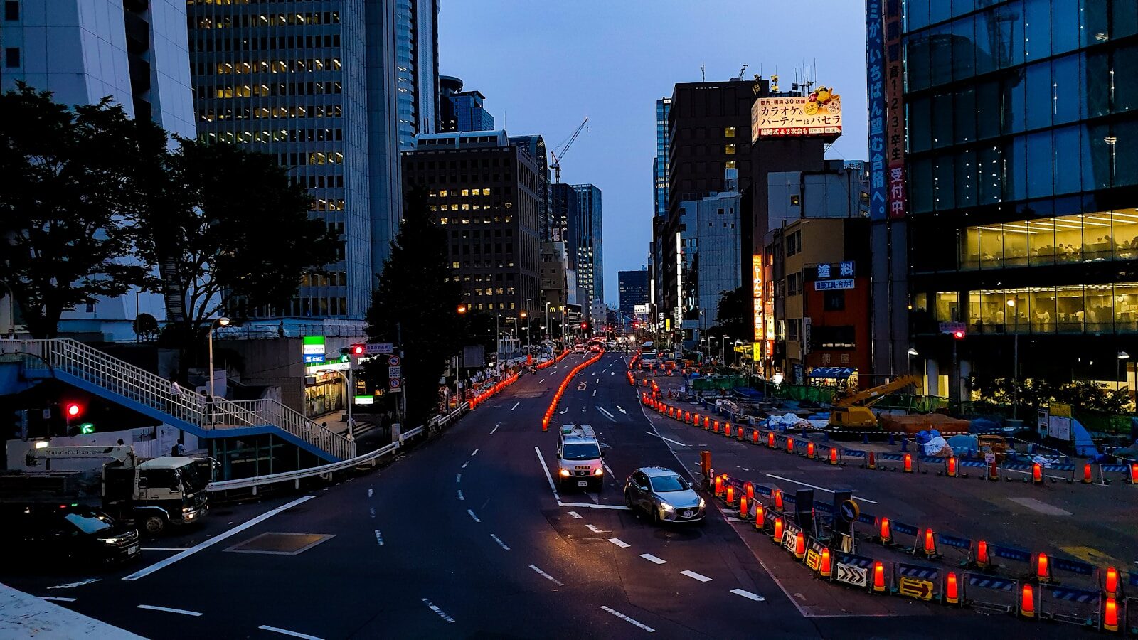 vehicles running on road at night