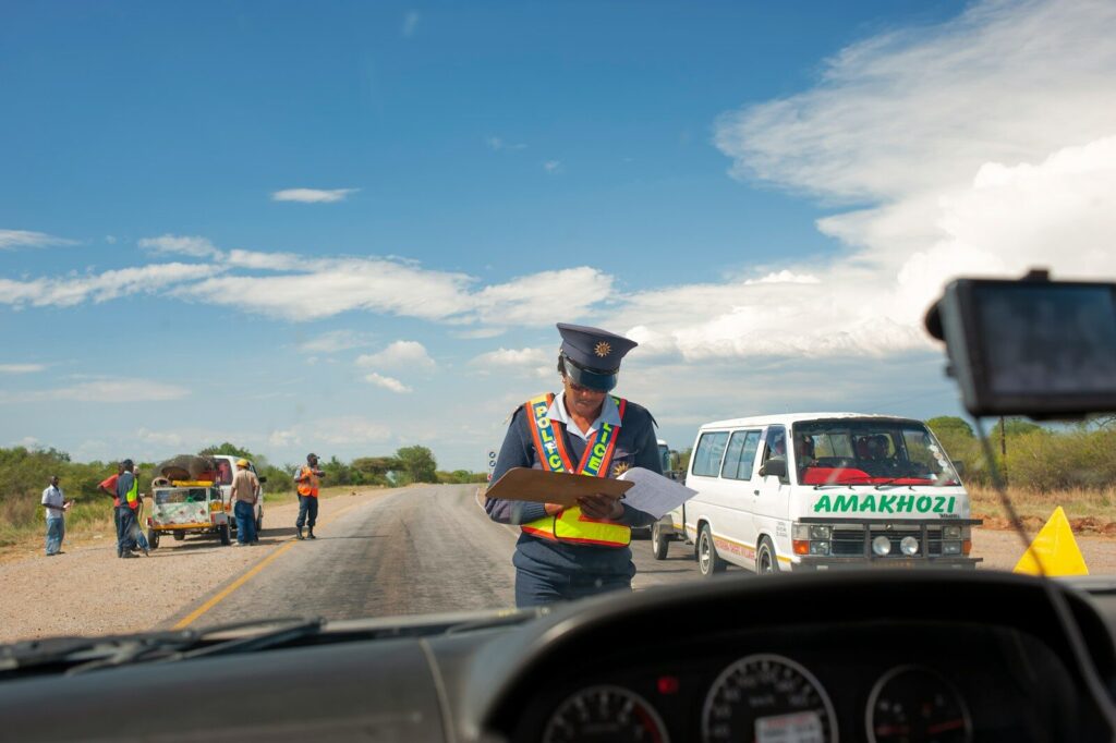 a police officer standing in the middle of the road