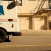a mail truck parked on the side of the road