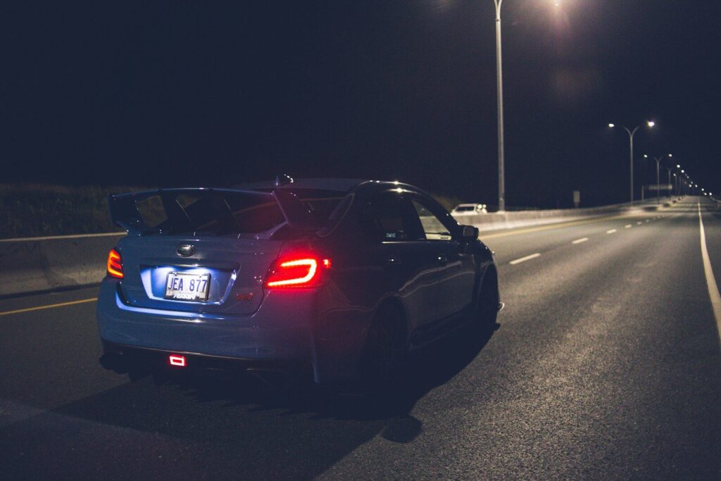 black bmw m 3 on road during night time