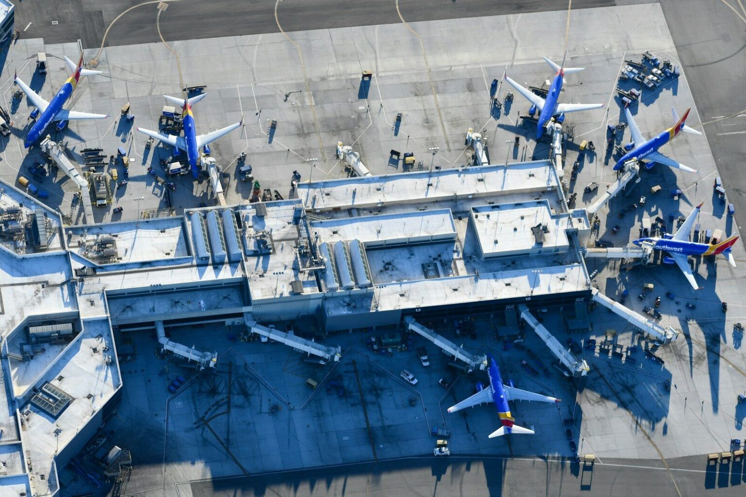 An aerial view of a blue and white airplane